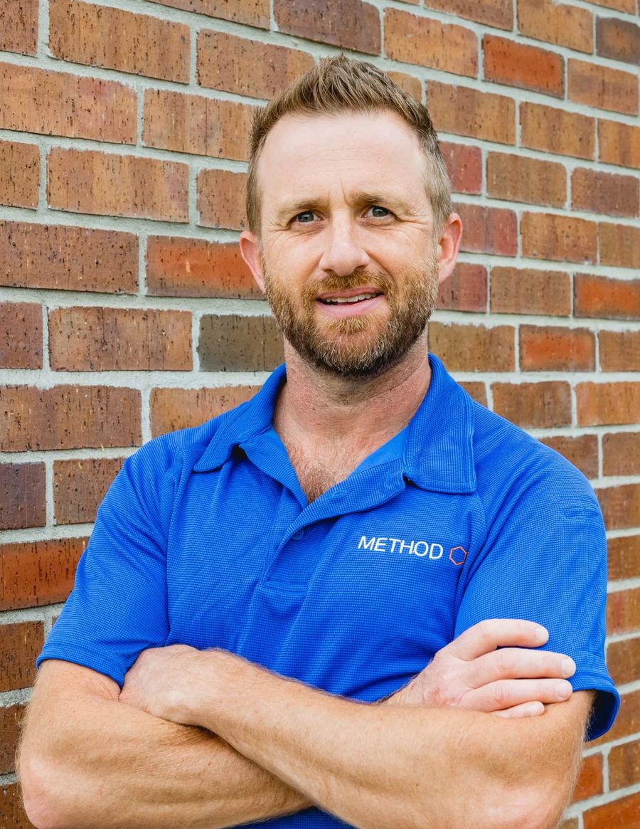 Vince Tantone, Method Inspections owner, in front of a brick wall